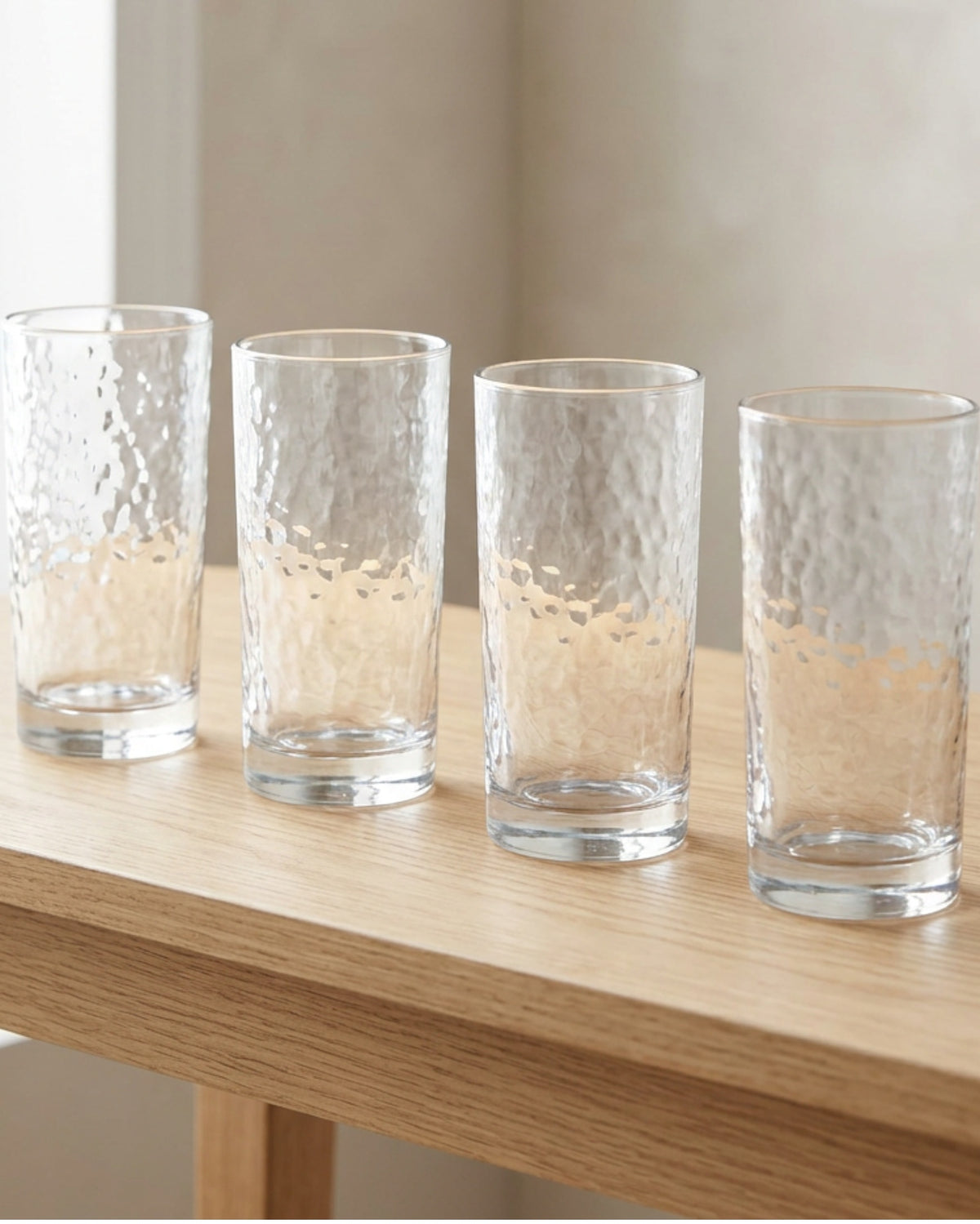 Buxto Tall Hammered Highball Glasses 14 oz Clear Set of 4 - Lifestyle view